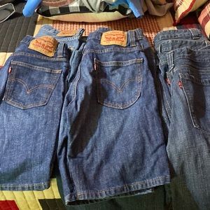 8 pairs of boys/men Levi’s jean shorts size 29 different styles on some as seen.